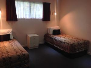 Postel nebo postele na pokoji v ubytování Central Park Motor Inn