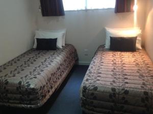 Postel nebo postele na pokoji v ubytování Central Park Motor Inn