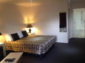 Postel nebo postele na pokoji v ubytování Central Park Motor Inn