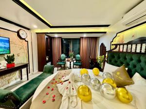 a hotel room with a large bed with flowers on it at Bảo Anh Hotel in Hanoi