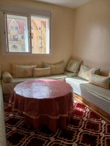 a living room with a couch and a table at Irini in Ifrane
