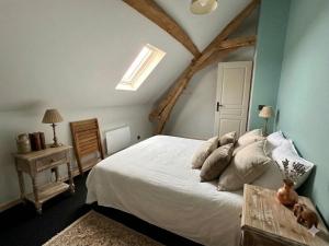 a bedroom with a large white bed and a window at 9 La Roche La Bergerie in Saint-Plantaire
