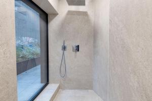 a shower in a bathroom with a glass door at Wok Rooms in Brussels +80 photos