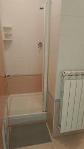 a bathroom with a bath tub and a shower at Il respiro del mare in Montesilvano +12 photos