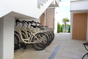 a row of bikes parked next to a building at Chmielowa2 - Apartamenty in Rowy