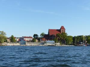a view of a city from the water at Dom Żeglarza in Puck