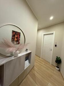 a living room with a large mirror on the wall at Residenza De Rose 2 in Cosenza