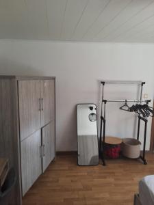 a room with a mirror next to a dresser at Le petit nid in Brugelette