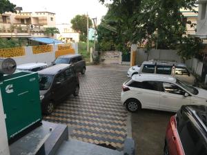 a group of cars parked in a parking lot at ROYAL RESIDENCY Ac in Virudunagar