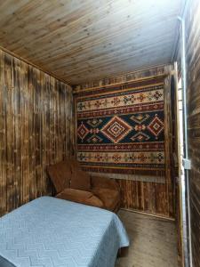 a small room with a bed and a couch in it at Moc's House bắc hà in Bắc Hà +119 photos