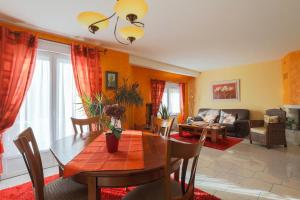 a living room with a table and a couch at Chambres D'hôtes Soizic in Paimpol