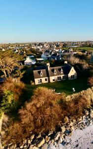 an aerial view of a house on a field at Villa Les Pieds dans l'Eau et sans canicule ! in Santec