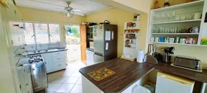 a kitchen with a wooden counter top and a refrigerator at Rivers Rest in Seafield