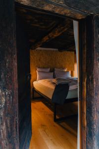 a bedroom with a bed in an attic at Corippo Albergo Diffuso in Corippo