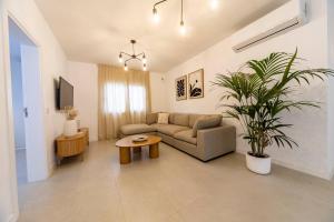 a living room with a couch and a table at Casa Dara's Sea in Playa Honda