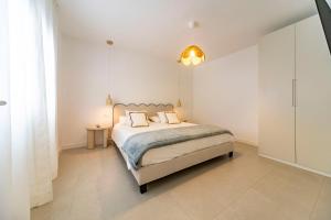 a bedroom with a bed with two pillows on it at Casa Dara's Sea in Playa Honda