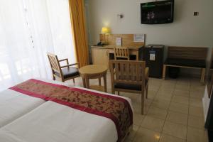 TV a/nebo společenská místnost v ubytování Central Hotel