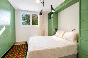 a bedroom with a bed and a window at Poly's Villa Lefkada in Lefkada