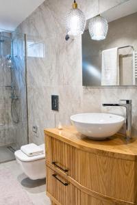 a bathroom with a sink and a shower and a toilet at Poly's Villa Lefkada in Lefkada