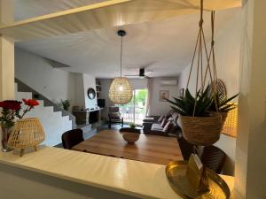 a living room with a table and a dining room at Breda 2b in L'Estartit +28 photos