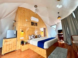 a bedroom with a bed in a tent at Glamo home kasauli in Kasauli