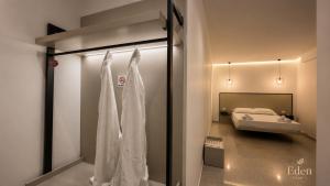 a room with a bed and a window with curtains at Eden Rooms in Vlorë