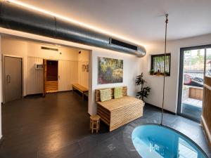 a living room with a couch and a tub in it at B&B GoldRain in Coldrano +8 photos