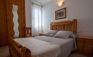 Postel nebo postele na pokoji v ubytování Hostal Sango Sierra de las Nieves