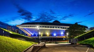 a building with blue lights on it at night at Studio Park Śląski Katowice/Chorzów in Chorzów