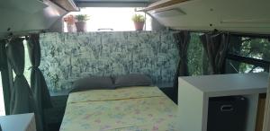 a bed in the back of an rv at Bus aménagé in Millas