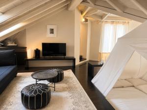 a living room with a couch and a table at Hotel Carducci 76 in Cattolica