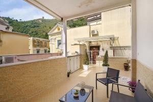 an apartment balcony with a view of a building at Angel's House in Sarno