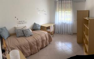 a bedroom with a bed and a desk in it at Villa Filomena in Montoro Inferiore