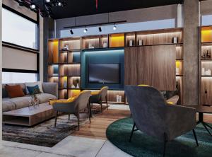 a living room with a couch and a tv at IBIS LAGOS LEKKI in Lagos