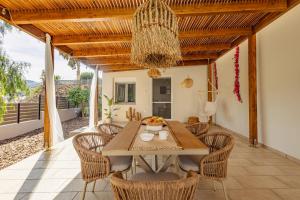 a dining room with a table and chairs at Seaside Breeze Villa - Beachfront, Private Pool, BBQ in Agia Pelagia