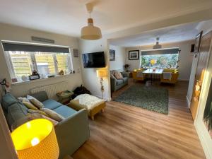 a living room with a couch and a table at Stags View in Invergarry
