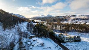 an aerial view of a house in the snow at Stags View in Invergarry