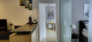 a kitchen with a counter and a table in a room at zeitlang by angelika kodewitz in Waldsassen