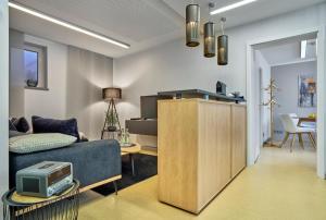 a living room with a couch and a tv at zeitlang by angelika kodewitz in Waldsassen