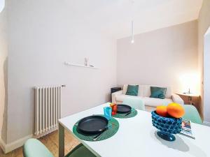 a living room with a table with fruit on it at Apartment Studio Kalè Akté by Interhome in Caronia