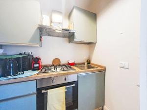 a small kitchen with a stove and a sink at Apartment Studio Kalè Akté by Interhome in Caronia
