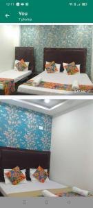 two beds with colorful pillows in a room at HOTEL TIRUMALA VAIBHAv in Secunderabad