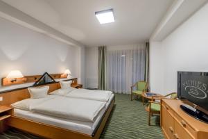 Letto o letti in una camera di Hotel Mathiesn
