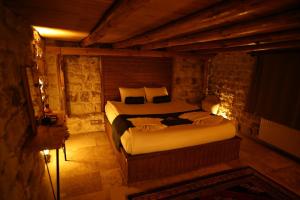 a bedroom with a bed in a room at Rock Mansion Cappadocia in Nar