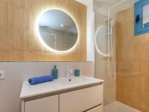 a bathroom with a sink and a mirror at Apartment Edificio Candela-1 by Interhome in L'Ametlla de Mar
