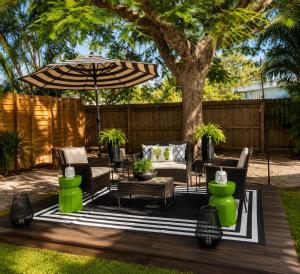 a patio with a table and an umbrella at Cozy RV tiny home in Fort Lauderdale