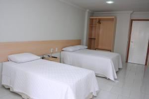 Кровать или кровати в номере Hotel Arezzu