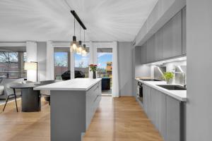 a kitchen with a large white island in a room at Modern Apartment in Ski in Siggerud