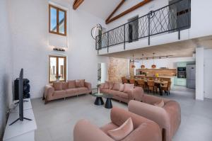 a living room with couches and a dining room at Villa Sofija in Vodnjan