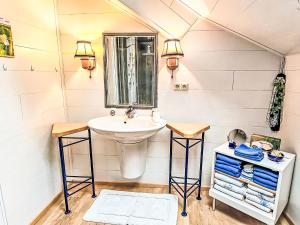 a bathroom with a sink and a mirror at Apartment Apt- Luna by Interhome in Feldkirchen in Kärnten